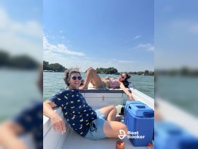 A fun day on the water with friends, enjoying the sun and laughter aboard a boat — perfect for summer outings and relaxation.