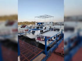 A collection of boats docked at the marina, showcasing various designs and features, perfect for day trips or leisure activities on the water.