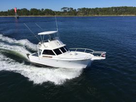 A sleek speedboat named 'Gotta Believe' navigates through calm waters, showcasing its impressive design and performance.
