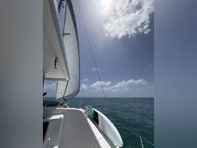 A stunning view of a sailboat underway, showcasing the sail and the serene ocean backdrop — perfect for sailing enthusiasts and adventure seekers.