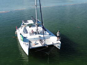 A relaxing moment aboard a catamaran with guests enjoying the serene waters — perfect for a day of leisure and exploration.