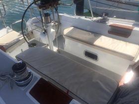 A clean and spacious interior view of a boat's helm and seating area, perfect for relaxing while cruising on the water.