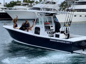 A lively group enjoys their time aboard a boat, showcasing the fun and excitement of a day on the water. Perfect for group outings and celebrations.