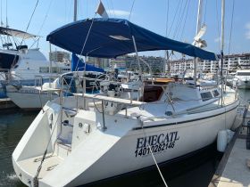 A well-maintained yacht docked at the marina, showcasing its sleek design and inviting atmosphere, perfect for leisurely outings on the water.