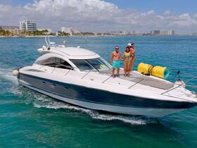 A joyful group enjoys a sunny day on a yacht, showcasing fun and celebration on the water — perfect for summer adventures.