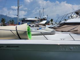 A close-up view of a floating mat on a boat docked in a marina, surrounded by other vessels — perfect for fun on the water.