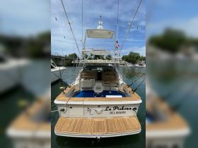 A detailed view of the interior of the fishing boat 'La Pichona,' showcasing comfortable seating and a well-equipped helm, perfect for a day on the water.