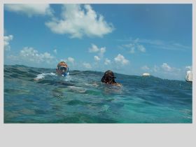 Two young snorkelers enjoy exploring the vibrant underwater world, showcasing the excitement of aquatic adventures.