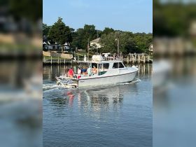 A lively group enjoys a day on the water aboard a boat, showcasing the fun and camaraderie of boating adventures.