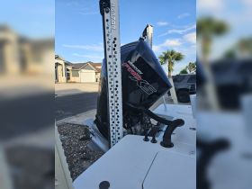 Close-up of a Mercury Pro XS motor mounted on a boat, showcasing essential equipment for performance and efficiency on the water.