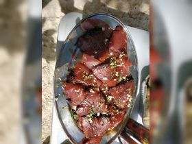A beautifully arranged platter of grilled fish garnished with herbs, perfect for a delicious onboard meal or catering during a boat trip.