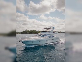 A stunning yacht cruising through clear waters, showcasing its sleek design and elegance — perfect for luxury charters and unforgettable adventures.