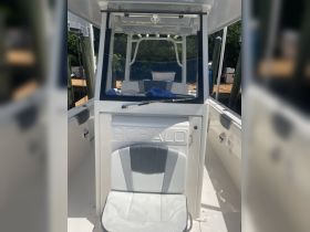 Interior view of a Robalo boat's helm and seating area, showcasing a clean and modern design ideal for fishing or leisure outings.