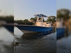 A striking view of a Blazer Bay boat gliding through calm waters, showcasing its sleek design and perfect for fishing or leisure outings.