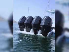 Close-up of powerful outboard engines on a boat, showcasing the impressive 300 HP performance — ideal for high-speed adventures on the water.
