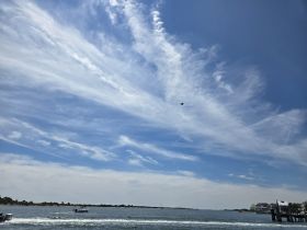 A scenic view of the sky and water, but the image lacks clarity and focus, making it difficult to identify specific elements.
