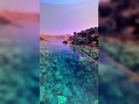 A stunning view of crystal-clear waters and rocky coastline, perfect for showcasing the natural beauty of the destination.