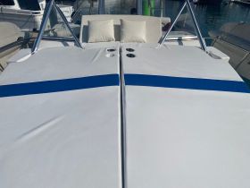 A close-up view of the comfortable seating area on a boat, featuring plush cushions and a sleek design, perfect for relaxing on the water.