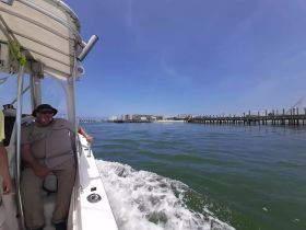 A relaxed moment on a boat with a smiling passenger enjoying the scenic views — perfect for capturing the essence of a day on the water.