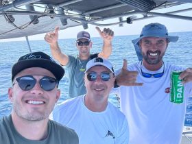 A group of friends enjoys a fun day on the water, showcasing smiles and camaraderie while boating. Perfect for capturing memorable moments on the sea.