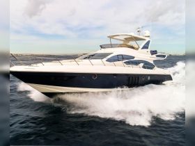 A stunning yacht cruising through the waves, showcasing its sleek design and elegance — perfect for luxury charters and ocean adventures.