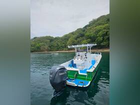 A vibrant center console boat docked in calm waters, showcasing its sleek design and powerful Yamaha engine, perfect for fishing or leisure trips.
