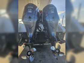 Close-up of twin Yamaha 300 V6 outboard motors, showcasing essential boat equipment for high-performance vessels.