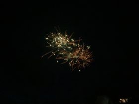 A vibrant display of fireworks lighting up the night sky, creating a festive atmosphere.
