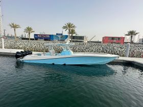 A sleek speedboat docked at the marina, showcasing its stylish design and powerful engines, perfect for thrilling water adventures.
