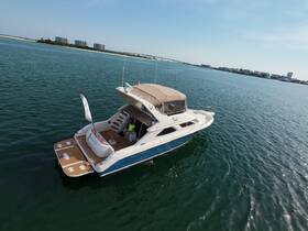 Aerial view of a luxurious yacht docked in calm waters, showcasing its elegant design and spacious deck — perfect for leisurely outings or private charters.