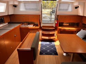 A well-appointed interior of a boat featuring a spacious cabin with modern amenities, perfect for comfortable cruising and relaxation.