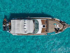 Aerial view of a group enjoying a luxurious yacht with a jet ski in stunning turquoise waters — perfect for summer adventures and water sports.