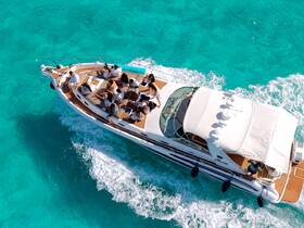 A lively group enjoys a day on a yacht cruising through crystal-clear turquoise waters, perfect for unforgettable adventures on the sea.