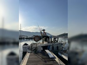 A well-maintained boat docked at the marina, showcasing its sleek design and readiness for adventure on the water.