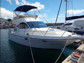 A pristine yacht docked at the marina, showcasing its sleek design and inviting atmosphere — perfect for luxury charters and coastal adventures.