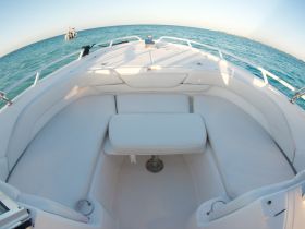 A spacious and inviting interior seating area of a boat, perfect for relaxing and enjoying the views while out on the water.