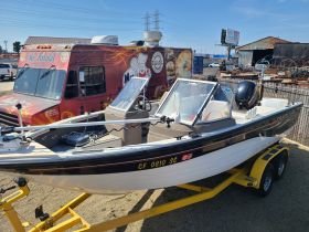 A well-maintained boat on a trailer, showcasing its sleek design and ready for a day on the water.
