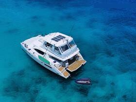 A stunning aerial view of a luxurious yacht cruising through crystal-clear turquoise waters, perfect for exploring beautiful destinations.