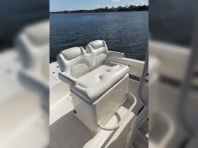 A close-up view of a comfortable seating area inside a boat, perfect for relaxing while navigating the waters.