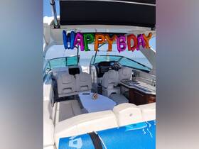 The interior of a boat is decorated with colorful 'HAPPY BDAY' balloons, creating a festive atmosphere for celebrations on the water.