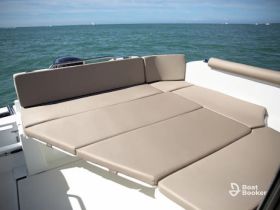 A cozy lounge seating area on a boat, perfect for relaxing and enjoying the views while out on the water.