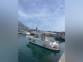 A beautiful yacht docked in a serene marina, showcasing its elegant design against a backdrop of clear skies and calm waters.