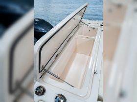 An interior view of a boat's cooler, showcasing its spacious design and functionality — perfect for keeping drinks and snacks fresh during outings.