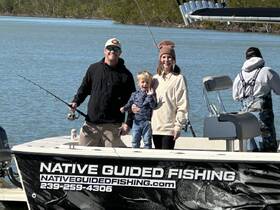 A family enjoys a fishing trip on a guided boat, creating lasting memories in the great outdoors. Perfect for family bonding and adventure on the water.