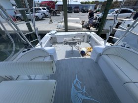 A well-appointed interior view of a boat's seating and helm area, showcasing the comfortable design ideal for fishing or cruising.