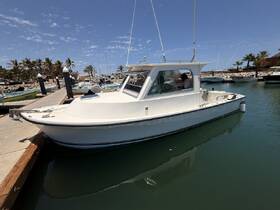A well-maintained boat docked at a marina, showcasing its sleek design and inviting atmosphere for a day on the water.