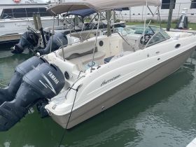 A sleek Hurricane speedboat docked at the marina, showcasing its stylish design and powerful Yamaha engines — perfect for a day on the water.