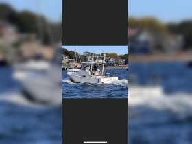 A fishing boat named 'Annie M' cruises through the water, showcasing the excitement of a day on the sea.