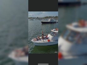 A lively group enjoys a fun day on the water, posing and celebrating aboard a boat — perfect for summer adventures and memorable outings.