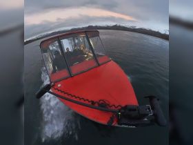 A group of friends enjoys an adventurous boat ride on a scenic waterway, surrounded by stunning mountain views — perfect for exploring the great outdoors.